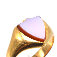 Victorian 18ct gold signet ring with shield-shaped carnelian stone, dating to the 1890s.