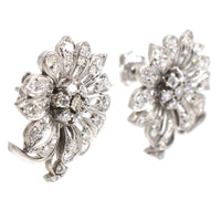 1940s 18ct white gold diamond flower cluster earrings with sparkling petals and central diamond cluster.