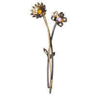 Early 20th century Austro-Hungarian gold brooch featuring topaz and diamond floral design.