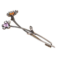 Austro-Hungarian gold brooch featuring pink and imperial topaz floral design with diamond accents.