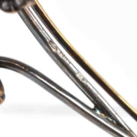 Close-up of hallmark details on an Early 20th Century Austro-Hungarian 14ct gold brooch.