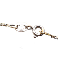 Close-up of clasp detail on 18ct white gold chain for vintage diamond cross pendant.