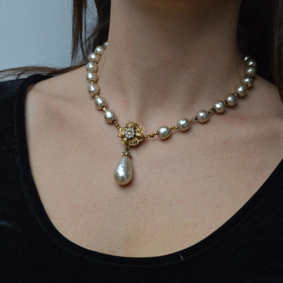 pearl necklace with chanel logo earrings